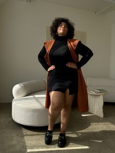 Stay ahead of the fashion curve in the Plus Size Long Knit Belted Sleeveless Cardigan! Perfect for that extra layer and anyone who loves a classic, this fall-favorite piece is great for throwing on over dresses or sweaters to complete any autumn outfit. This sleeveless coat features a draping collar, a drawstring around the waist, and two pockets on each side. The material is a soft, stretchy woven. This coat is made from 100% Polyester. Imported. Hand wash cold. Do not bleach. Do not tumble dry Black Sleeveless Cardigan For Spring, Chic Black Sweater Vest For Fall, Chic Black Sweater Vest For Winter, Elegant Black Sweater Vest For Fall, Elegant Stretch Sweater Vest For Fall, Elegant Fall Sweater Vest, Sleeveless Vest For Layering In Fall, Sleeveless Vest For Fall Layering, Fall Sleeveless Vest For Layering