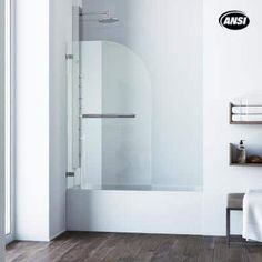 an empty bathroom with white walls and wood floors