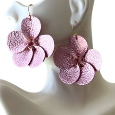 These small 2x2" handmade leather flowers are the perfect gift for a special person in your life. A gift that is as unique and beautiful as she. **Now both are with gold plated nickel free ear wires.** These earrings are crafted with high-quality, lightweight leather available in gorgeous metallic pink and shimmery green. You can also message me for custom colors (orange, red, black, etc.) or a bouquet of earrings. Whether you are heading to a business meeting, a ladies' night, or a date night, Nickel-free Flower-shaped Party Earrings, Party Flower Earrings, Handmade Adjustable Flower Earrings For Gift, Leather Flower, Colors Orange, Earrings Christmas, Christmas Gift For Her, Leather Flowers, Metallic Pink