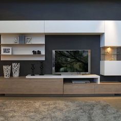 a modern living room with white and wood furniture, black walls and carpeted flooring