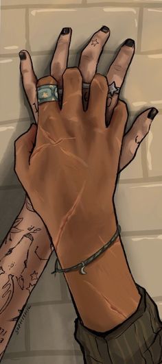 two hands with tattoos on their arms and one holding the other's hand in front of a brick wall