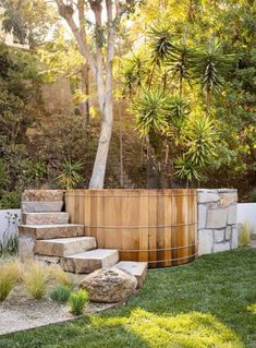 an outdoor garden with stone steps and trees