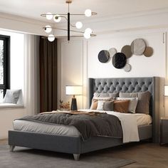 a bedroom with a bed, nightstands and two lamps on either side of the bed