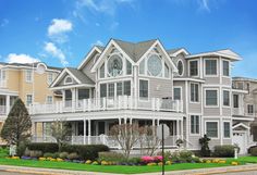 a large white house with many windows and balconies