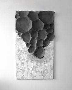 a black and white photo of some fruit on a piece of paper that is hanging on the wall