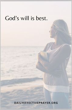 a woman standing on top of a beach next to the ocean with a cup in her hand