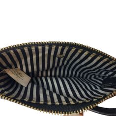 Classic little black wristlet that has a top zip closure, one outside zip pocket and striped inside lining. Considering this has been used quite a bit, it is still in really good condition. Gold hardware.Does not come with dust bag.Size: Womens OSApproximate Measurements: Height: 4.25 in / 11 cm Length: 6.5 in / 17 cm Drop: 6.5 in / 17 cmCondition: Pre-Owned GoodAll pieces are stored in a smoke-free, pet-free environment. If flaws are identified on the item, this will be disclosed in the descrip Black Wristlet, Black Pebbles, Kate Spade Wallet, Wristlet Wallet, Leather Wristlet, Pebbled Leather, Gold Hardware, Zip Pockets, Kate Spade