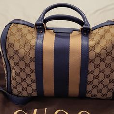 Pre-Owned Gucci Satchel Bag With Strap Only Used A Few Times And Comes With Dust Bag It's An Authentic Bag So Plz No Low Balling Gucci Travel Bags With Gold-tone Hardware, Gucci Monogram Canvas Travel Bag, Gucci Designer Satchel With Leather Handles, Designer Gucci Satchel With Leather Handles, Blue Gucci Travel Bag, Designer Gucci Monogram Canvas Satchel, Blue Rectangular Gucci Bag, Blue Gucci Shoulder Bag, Blue Gucci Shopping Bag