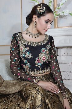 Choli: Pure raw silk choli, chiffon sleeves, featuring antique gold dabka, sequins, beads, stones, pearls and multi colored silk thread embroidery.Choli Color: BlackLehnga: Pure atlas jamawar Lehnga finished with golden border.Lehnga Color: Black and antique GoldDupatta: Pure Crushed maysuri dupatta featuring sequin motifs and sprinkles all over finished with gota.Dupatta Color: Antique Gold This is a made to measure look, once order is placed design team will get in touch with you regarding mea Jamawar Lehnga, Silk Thread Embroidery, Golden Border, Designer Outfit, Chiffon Sleeves, Pakistani Designers, Thread Embroidery, Silk Thread, Wedding Wear