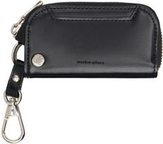 Waterproof 3M™ SCOTCHGARD®-treated buffed leather key case in black. · Stain- and oil-resistant · Lanyard-clasp fastening at top · Logo stamp and card slot at face · Zip closure · Four lanyard-clasp fastenings at interior · Two card slots at interior · YKK® Excella® hardware · H3.25 x W4.25 x D0.75 Supplier color: Black Modern Black Wallet With Key Clip, Leather Key Case, Master Piece, Black Gloss, Handbag Wallet, Black Phone Case, Key Case, Leather Key, Wallet Accessories