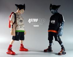 two dolls are standing next to each other in front of a gray background with the words astro on it