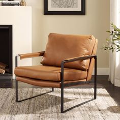 a tan leather chair sitting in front of a fireplace