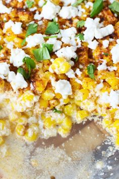 corn and feta pizza with basil on top