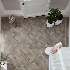 an overhead view of a bathroom with wood flooring