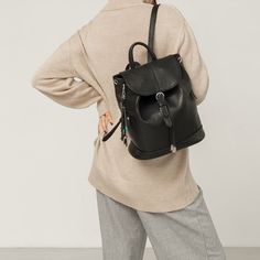 This backpack will perfectly complement almost any set. In the frantic pace of the big city, this ability makes it an indispensable thing: whatever you wear in the morning, it will fit into the look, and you won't have to spend time choosing the right handbag.The functionality of this backpack can compete with the most seemingly practical models. It is tightened on a strong string and closed with a valve, with a reliable metal clasp. Zippered pockets on the sides - for quick access to the necess Leather Anti-theft Bag For Travel, Leather Anti-theft Bag For On-the-go, Casual Leather Backpack For Commuting, Anti-theft Leather Bag, Modern Leather Bags With Anti-theft Features, Modern Leather Anti-theft Bags, Leather Anti-theft Backpack For Daily Use, Anti-theft Leather Backpack, Leather Anti-theft Backpack For Everyday