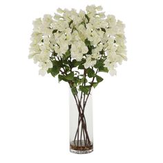 a vase filled with white flowers on top of a table