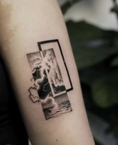 a woman's arm with a black and white photo on it