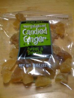 a bag of candied ginger sitting on top of a wooden table