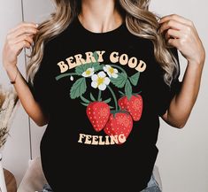 This Strawberry T-Shirt is perfect for feeling strawberry good :)  For all strawberry lovers who love fruits or who are simply very cheerful. It is also a very sweet berry gift for Christmas & birthdays. As well as it is a gift for gardeners. ♥ PRODUCTION TIME: 1-5 days (Usually 2-3 days) ♥ SHIPPING TIME: 2-5 days (Usually 3 days) ♥ PRODUCT DESCRIPTION: Bella Canvas Unisex T-shirt Super soft cotton and excellent quality print makes. 100% Soft cotton (fibre content may vary for different colors) Light fabric (4.2 oz/yd² (142 g/m Runs true to size Our Relaxed Fit Tee (Bella + Canvas style 3001) is a unisex style that runs a touch small for men, and about a half a size large for women. It's a relaxed fit and is soft and cozy. * For T-shirt Sizes Please refer to the Listing Image. ♥ CARE INSTR Strawberry Shortcake Shirt, Strawberry Tshirt, Strawberry T Shirt, Fruit Shirt, Strawberry Shirt, Botanical Shirt, Cute Strawberry, Gift For Christmas, Strawberry Shortcake