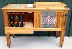 a wooden cabinet with wine bottles in it