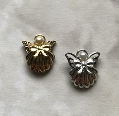 Guardian Angel Pin #157  This is the tiniest of my shell angel pins.  She is available in bright gold or silver with your choice of a crystal, pearl, or birthstone head.  Size: 3/8"x 3/8"  #angel Angel Pins, Birthstone, Shells, Angel, Crystals