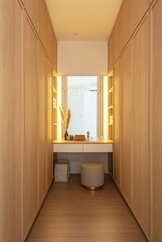 a bathroom with wooden walls and flooring next to a counter top on one side