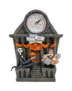 a clock that is on the side of a building with skeletons sitting in front of it