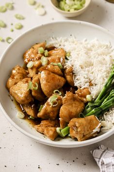 a white bowl filled with rice and chicken