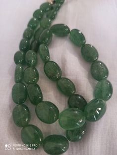 19'' AA Natural Green Strawberry Quartz 282 Carat Fine Quality Smooth Oval Beads Gemstone Necklace Stone :Natural Green Strawberry Quartz Shape :- Oval Size :- approx 6x8- 10x15 mm 1. Weight :- 282 carat - 21 inch Purity :- 100% Natural Gemstone Polish :- Handmade color - green makes a great gift for your loved ones. It is known as the 'love stone' as the message it emits is the strong vibration of unconditional love, joy, warmth and healing. As quartz crystals are profound amplifiers of energy, Oval Hand-strung Beaded Necklaces As Gifts, Oval Hand-strung Beaded Necklace For Gift, Green Oval Gemstone Bead Necklace, Green Oval Gemstone Beaded Necklace, Green Oval Gemstone Beaded Necklaces, Oval Natural Stone Beads For Gifts, Oval Green Gemstone Beaded Necklaces, Spiritual Oval Beaded Necklace With Gemstone Beads, Oval Natural Stones For Jewelry Making