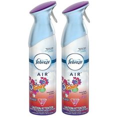 two bottles of febreze air freshener sitting side by side on a white background