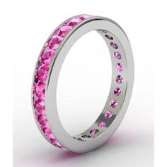 a ring with pink stones is shown on a white background and it looks like it has been