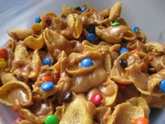 a plastic container filled with cereal and candy