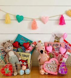 two baskets filled with stuffed animals and books