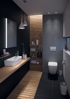 a modern bathroom with wood flooring and black walls