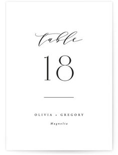 the table number card is shown in black and white with an elegant calligraphy font