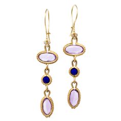 Royal, regal and rich in jewel tones, these earring will make you feel like an Empress. Amethyst is known as a stone of peace and unification. It is also thought to evoke feelings of serenity and calmness in those who wear it. Our 14k gold Clover earrings feature oval, rose cut amethysts and round rose cut lapis lazuli accented by full cut white diamonds. Pictured in:14k yellow gold4.4ct amethyst.60ctw lapis lazuli.03ctw full cut white diamonds2" length Jennifer Dawes Design curates the most bea Elegant Oval Multi-stone Earrings, Exquisite Yellow Gold Earrings With Gemstone Accents, Elegant Yellow Gold Multi-stone Earrings, Luxury Amethyst Earrings With Gemstone Accents, Exquisite Multi-stone Gold Earrings, Exquisite Gold Multi-stone Earrings, Elegant Multi-stone Gemstones In 14k Gold, Luxury Purple Multi-stone Earrings, Elegant 14k Gold Earrings With Gemstone Accents