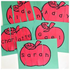 four pieces of paper cut out to look like apples with the words charlotte and gael written on them