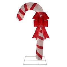 a candy cane is wrapped in red and white paper with a light up bow on top