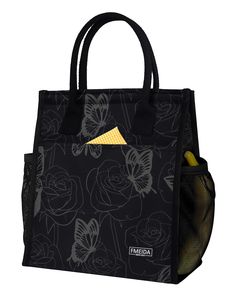 a black bag with butterflies on it and a banana in the front pocket, sitting next to a yellow zipper