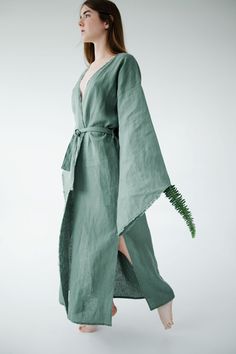 This Kimono linen dress is Fit perfectly with all women's body shapes. Easy to wear, simple and perfect for many occasions. You can wear it at home, in the forest, at a resort, or in the city, adding accessories. Boho style wrapped dress with belt Length 140cm/56in Wide long sleeves Fringed edges Side cut 50 cm/ 20 in Made of 100% natural linen, Oeko-Tex certified, free of harmful chemicals. This is a wear-resistant material and could be washed a lot of times. Sizes: XS, S, M, L, XL, XXL Custom Bohemian Green Linen Dress, Green Bohemian Linen Dress, Green Bohemian Wrap Maxi Dress, Green Linen Bohemian Dress, Bohemian Ramie Maxi Dress For Spring, Spring Linen Wrap Maxi Dress, Eco Friendly Clothes, Linen Summer Dress, Linen Robe