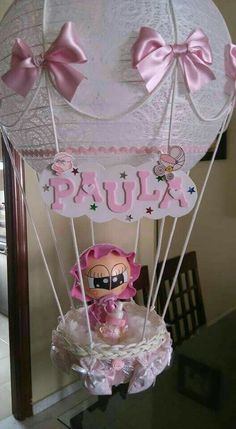 a pink and white hot air balloon with the name paula on it