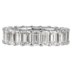 This stunning diamond eternity band showcases 6.69ct of perfectly matched emerald cut diamonds graded at E-F, VVS2-VS1. The diamonds are set in a classic 18k white gold basket setting style. All eternity bands are shown in a size 6.5. We custom craft each eternity band and will create the same design for you in your desired ring size. Please contact us with any questions. Thank you. Emerald Cut Diamond Eternity Band, Lab Created Engagement Rings, Emerald Cut Eternity Band, Memory Ring, Mark Broumand, Diamond Eternity Band, Emerald Cut Diamond, Unique Diamonds, Eternity Ring Diamond