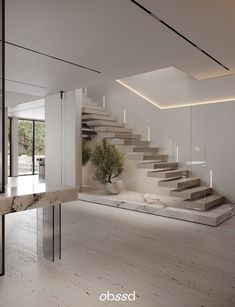 the interior of a modern house with white walls and stairs