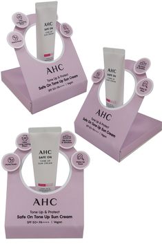 three different types of ahc products in pink boxes with white caps and lids on them