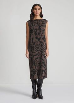 This sculptural dress is crafted in Fall 2024's mid-century modern Wood Grooves motif printed atop delicate lace that's transformed by meticulously rendered plissé folds. The skimming, bateau neck design features slight cap sleeves and falls midi hem. Details: Straight silhouette Bateau neckline Slight cap sleeve Pullover Garment plissé Calf length Cotton-silk slip; tacked at shoulder 100% Polyester; Imported Dry clean recommended or hand wash cold Elegant Jacquard Knit Midi Dress, Chic Jacquard Knit Formal Dress, Chic Formal Jacquard Knit Dress, Elegant Evening Dresses In Jacquard Knit, Sculptural Dress, Fall Midi, Plisse Dress, Stylist Outfit, Mid Century Modern Wood