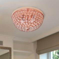 a chandelier hanging from the ceiling in a living room