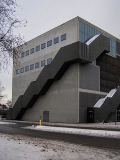 an unusual building with stairs on the outside