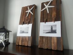 two wooden boards with pictures and starfish on them sitting on a table next to a lantern