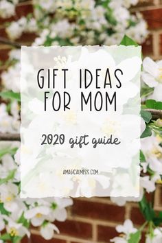 white flowers with the words gift ideas for mom on it in front of a brick wall