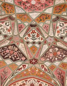 an intricately decorated ceiling with flowers and leaves